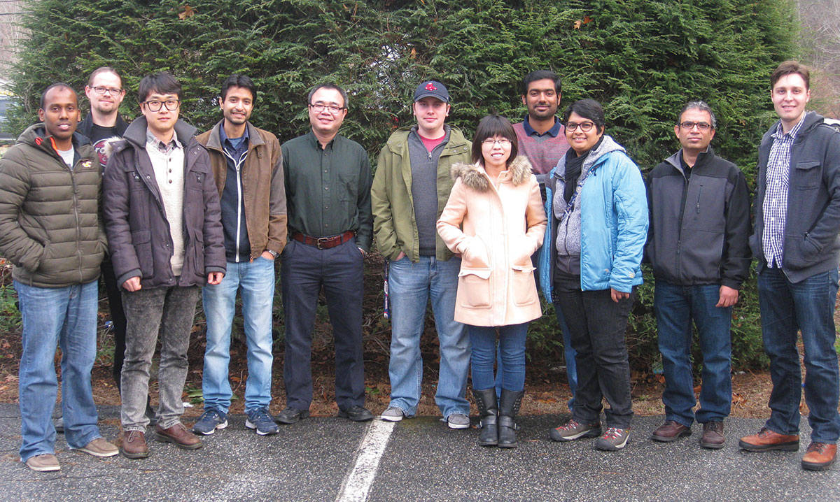 (Left to right): Dr. Venkatesh Botu, Ph.D., currently a research scientist at Corning Inc.; Dr. Martin Hoffman, a visiting scientist; Dr. Chiho Kim, Postdoctoral fellow; Rohit Batra, third-year Ph.D. student; Dr. Huan Tran, Postdoctoral fellow; James Chapman, Lihua Chen, Arun Kumar Mannodi Kanakkithodi, all graduate students; Dr. Sridevi Krishnan, Postdoctoral fellow; Dr. Ramprasad, and Erik Nykwest, graduate student.