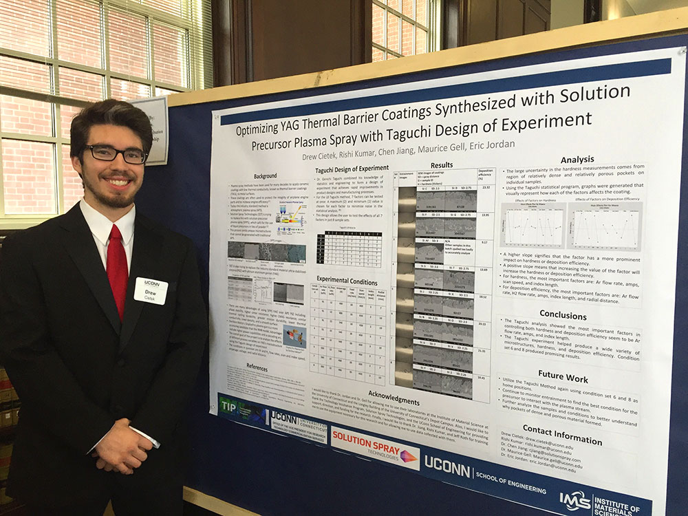 Drew Cietek in front of his poster entitled "titled “Optimizing YAG Thermal Barrier Coatings Synthesized with Solution Precursor Plasma Spray with Taguchi Design of Experiment.” A Taguchi design of experiment was utilized on the Sinplex plasma gun to discover a set of process variables that would result in a dense and uniform yttria aluminum garnet (YAG) coating synthesized with solution precursor plasma spray. 