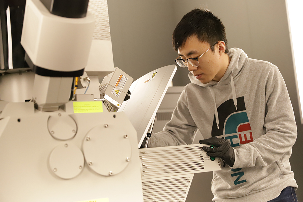 MSE graduate student, Shuyang Xiao, making microscale samples used in his Nano Letters publication. 