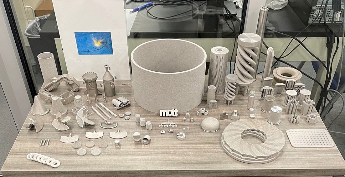 photo of examples of the unique geometries and consolidation of parts made possible by the metal additive manufacturing process. These components all incorporate precisely controlled porosities for various filtration and flow control applications.