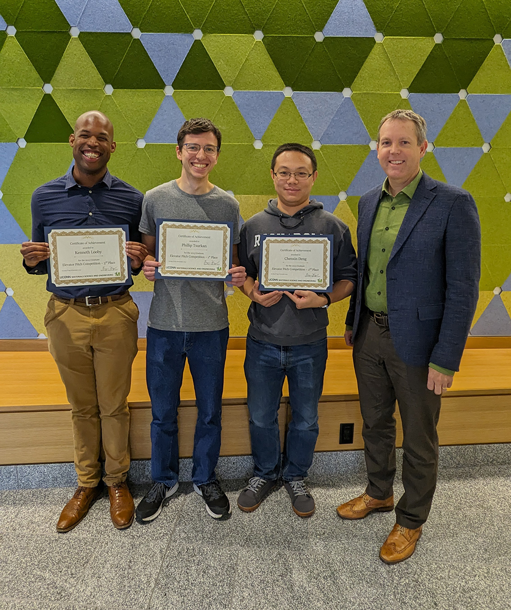 From left to right: Kenneth Looby (3rd place), Phillip Tsurkan (1st place), Chenxin Deng (2nd place), and Bryan Huey (MSE Department Head).